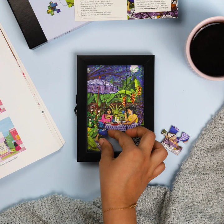 Artwork in puzzle featuring two women at a cafe | home decor goods