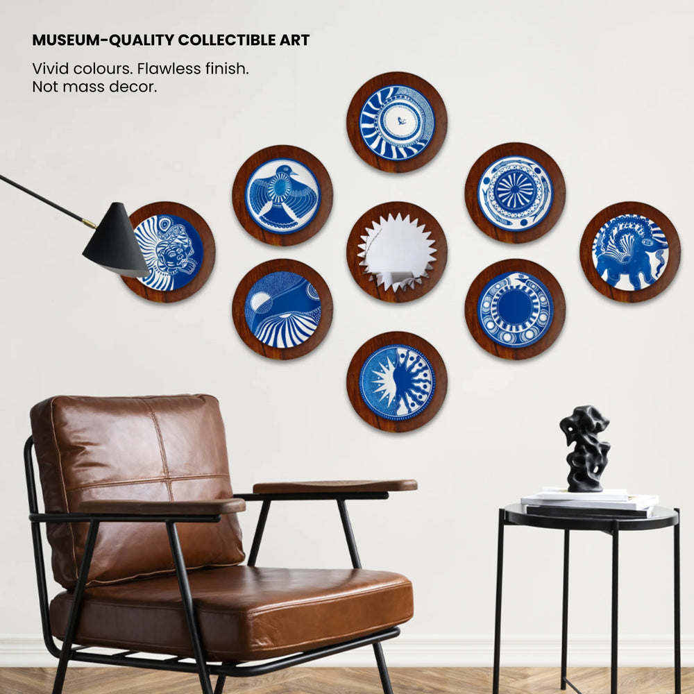 Decorative wall art pieces in blue and white with a mirror in the centre