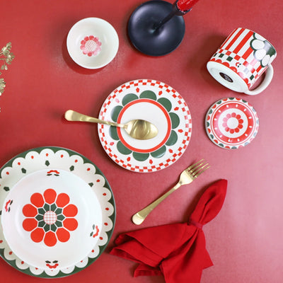 Entire Kolkata inspired red and green ceramic dinnerware set paired with golden cutlery