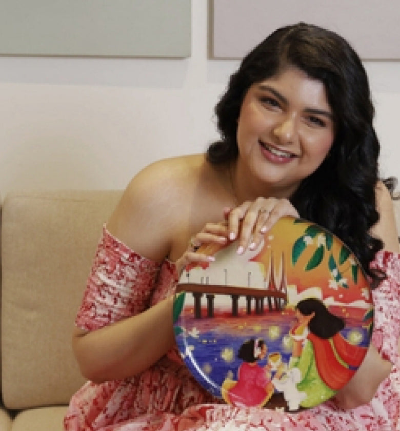 Holding a painted art plate